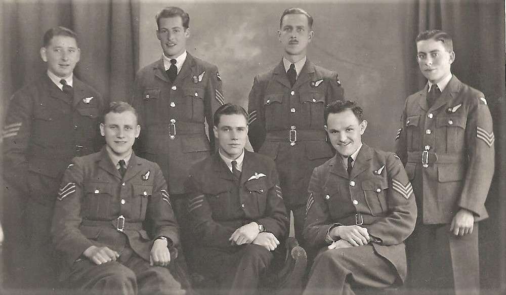 Studio portrait of a wartime RAF bomber aircrew in uniform
